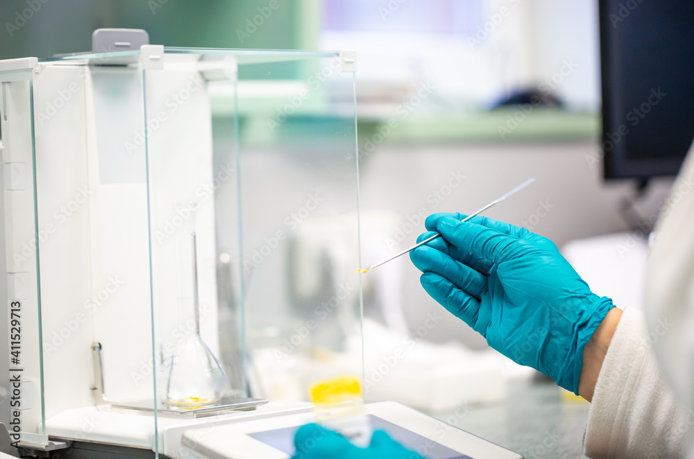 Process of weighing of ingredients for the production of a drugs in the pharmacy industry, pharmacial concept Process of weighing of ingredients for the production of a drugs in the pharmacy industry, pharmacial concept