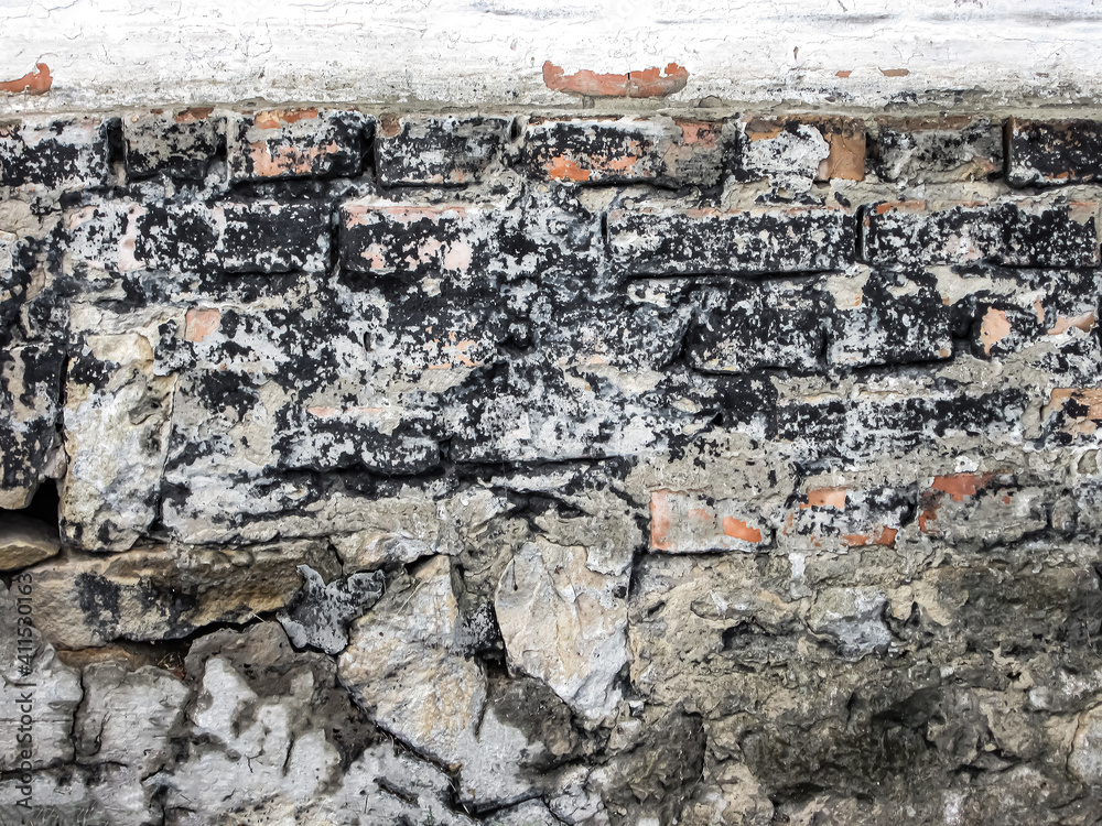 Mixed stones in concrete. Abstract background with bricks of different shapes. Mixed type in construction. Mixed stones in concrete. Abstract background with bricks of different shapes. Mixed type in construction.