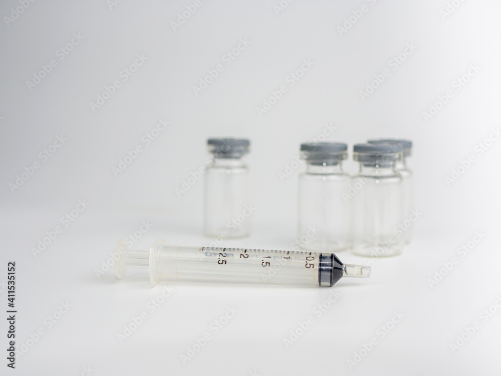 Syringe and vaccine bottle On a white background