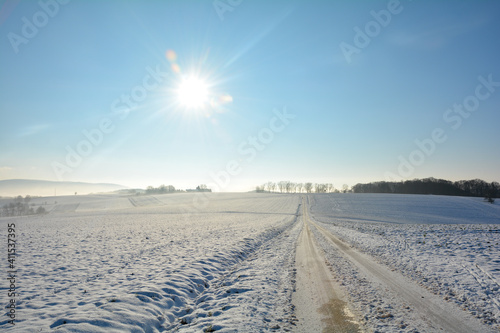 Snow-covered road in winter in the countryside © Claudia Evans 