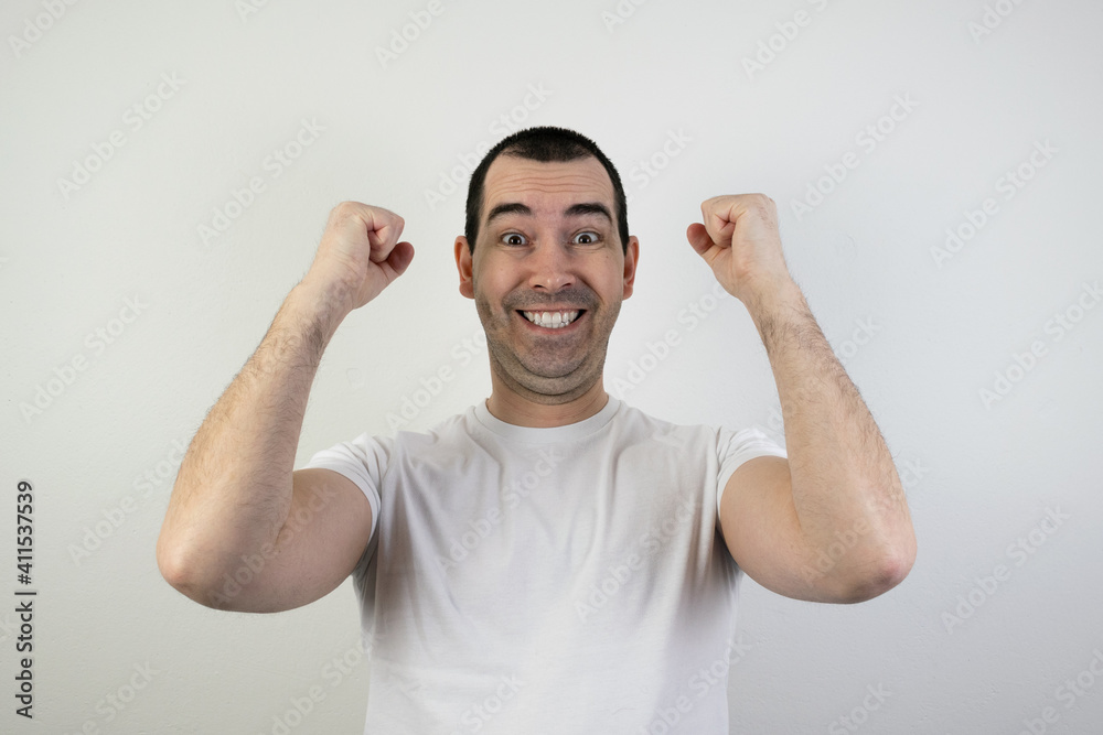 happy excited young man stand white background laugh hands up crazy look angry happy excited young man stand white background laugh hands up crazy look angry