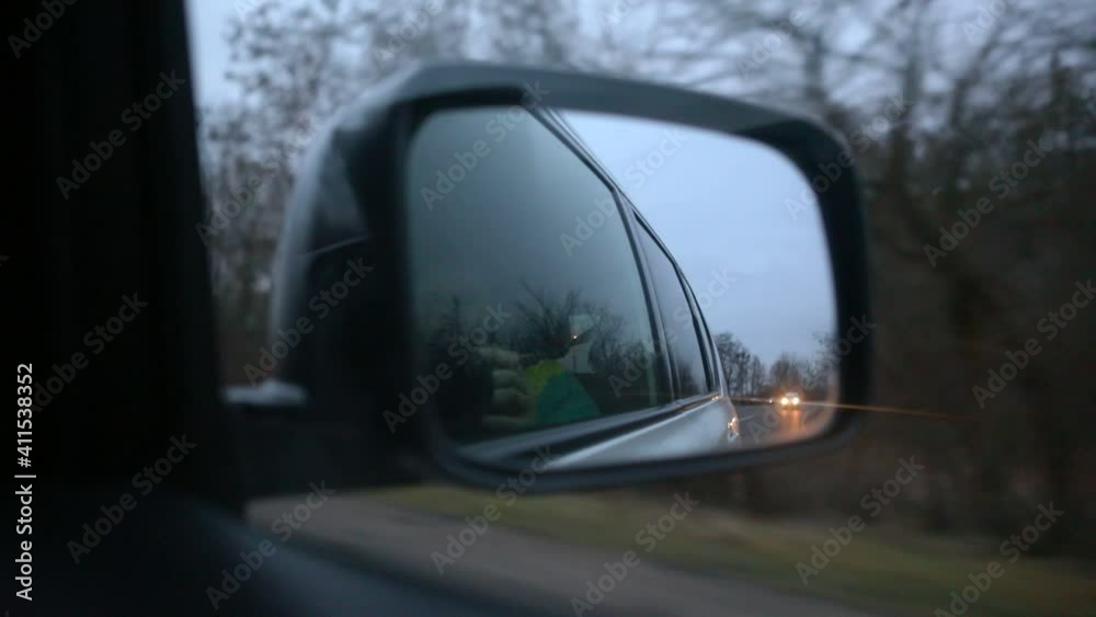 reflection of road in rear car mirror reflection of road in rear car mirror