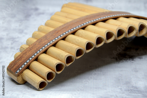 Close-up of woodwind instrument pan flute. Details of musical instruments, music. photo