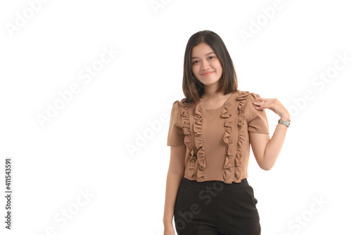 Asian business women is standing put her hand on  shoulder and smile on a white background.