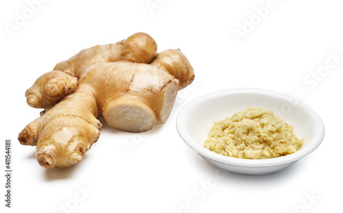 close up freshly cut ginger and grated ginger in a white dish isolated on white background with clipping path 