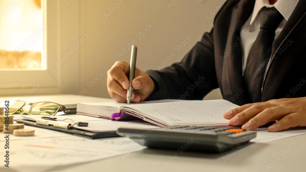 Business men documenting finance by the window and warm sunlight financial management ideas and working paperwork. Business men documenting finance by the window and warm sunlight financial management ideas and working paperwork.