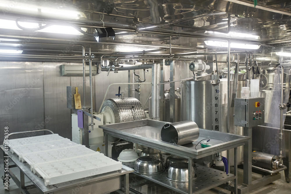 Background image or steel machine units at cheese and dairy factory, food production, copy space