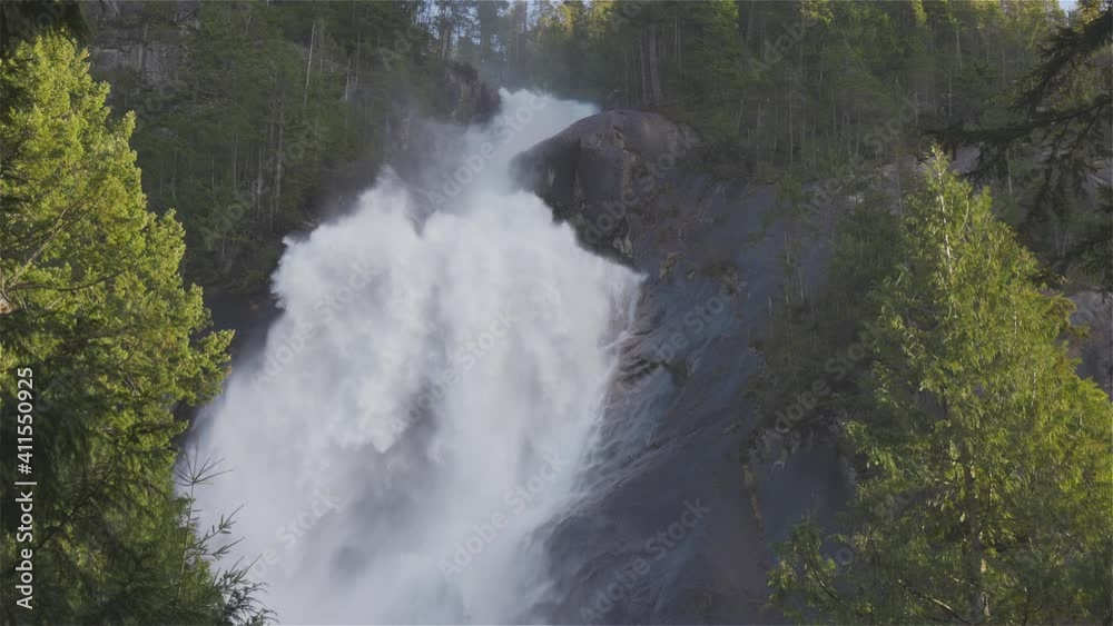 View of Shannon Falls and water rushing down the canyon during a sunny winter day. Located in Squamish, North of Vancouver, British Columbia, Canada. Nature Background Panorama. Slow Motion View of Shannon Falls and water rushing down the canyon during a sunny winter day. Located in Squamish, North of Vancouver, British Columbia, Canada. Nature Background Panorama. Slow Motion