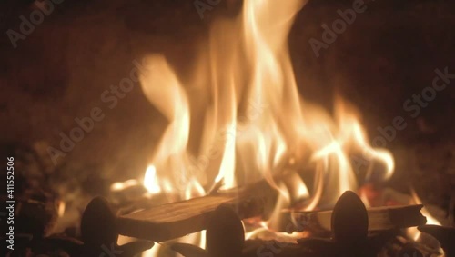 Logs burning in a romantic fire in a dark room