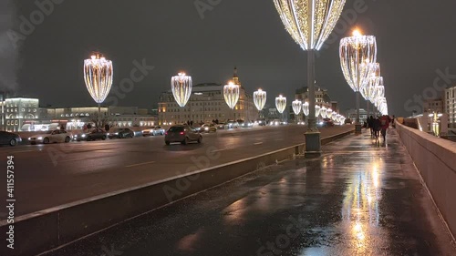 Russia. Moscow. 19.12.2020 View of the roadway of the Zamoskvoretsky bridge decorated with Christmas illumination. photo