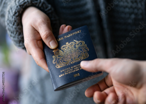 man handing new post Brexit blue British passport Devon, United Kingdom, January, 2021