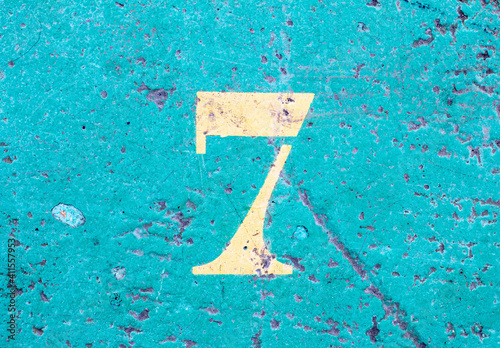 number 7 on a colored concrete floor