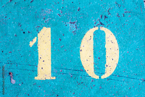 number 10 on a colored concrete floor