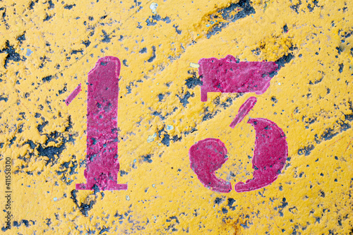 number 13 on a colored concrete floor