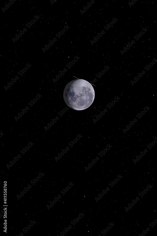 An amazing astronomical event, Moon surface covers planet Mars awe night sky view with an advanced amateur telescope. A dreamlike perspective view of our solar system and the Planets relative movement