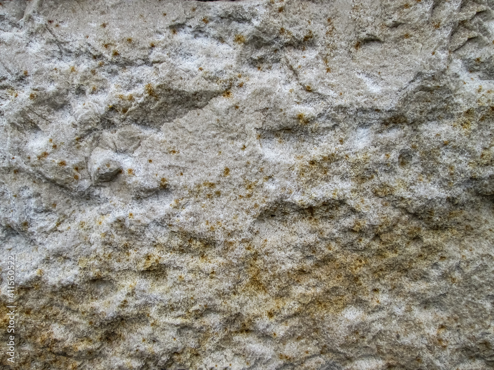 Grainy texture of sandy stone. Rough surface with golden dots. Grainy texture of sandy stone. Rough surface with golden dots.