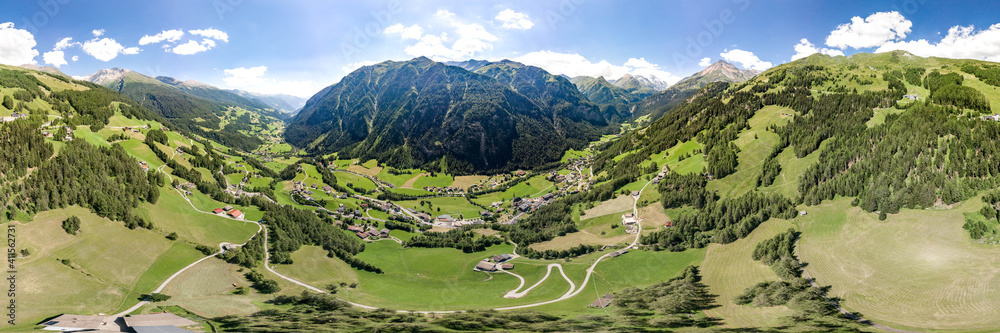 360 Aerial panoramic drone shot of Helligenblutt village in Grossglockner  mountain valley in Austria Stock Photo | Adobe Stock