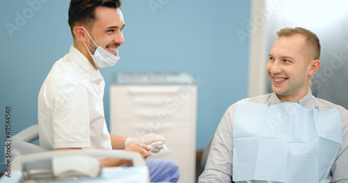 Small talk between patient and dentist, preparing for the dental check up at the dental office. Regular visit to the orthodontist. 4k video screenshot, please use in small size