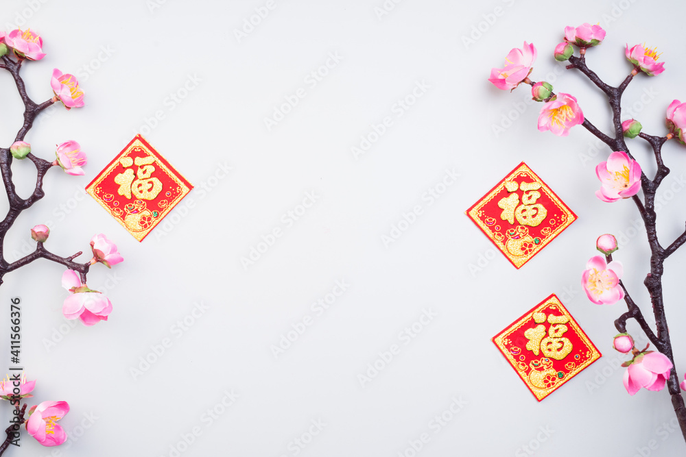 Chinese New Year design with cherry blossom and red lanterns on light grey background