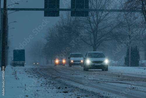 Cars driving in the snowstorm, cars driving in the snow, cars on a snow-covered street, Berlin, Germany