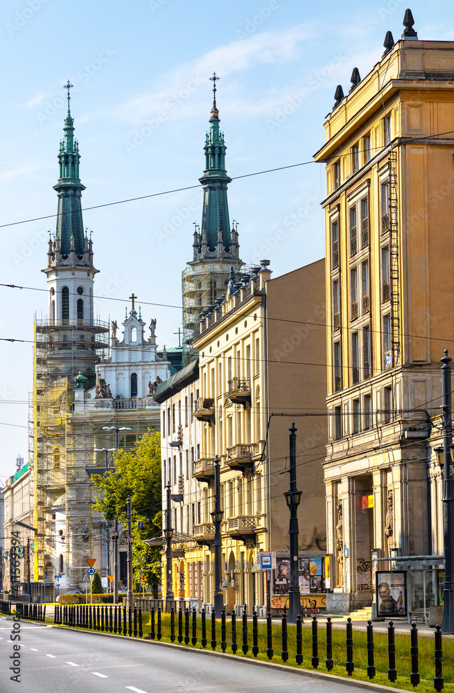 Fototapeta premium Panoramic view of ul. Marszalkowska street with communist architecture of MDM quarter and Holiest Savior Church in Srodmiescie district of Warsaw, Poland