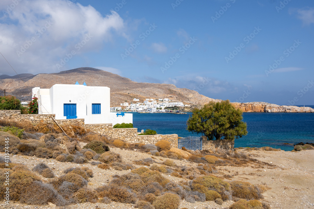 Typical Cycladic architecture, whitewashed summer villa overlooking the sea. Folegandros island, Greece