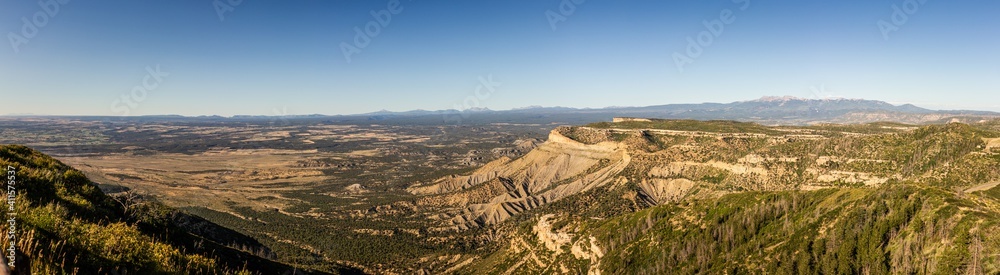 Panorama shot of view to flat valley of america nature from cliff of mesa verde at sunny day Panorama shot of view to flat valley of america nature from cliff of mesa verde at sunny day