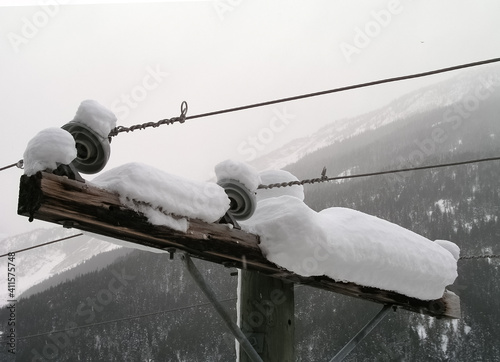 Snow laden elctricity crossarm in Canada photo