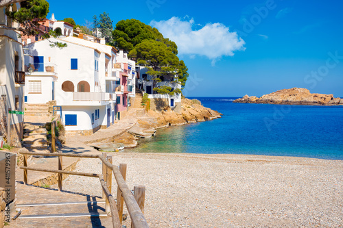 View of the beach of Sa Tuna with the houses that maintain the appearance of the old fishermen's houses creating very picturesque corners. Begur, Costa Brava, Catalonia, Spain