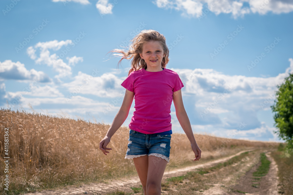 girl enjoying summer time in magic sunny afternoon in golden hour time
