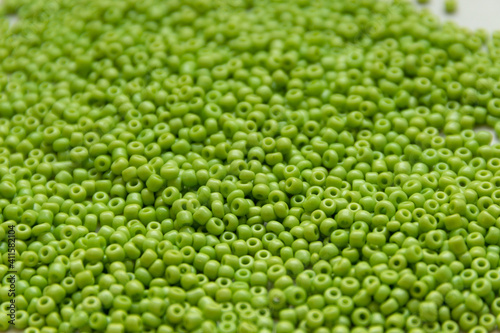 Green beads background, close up