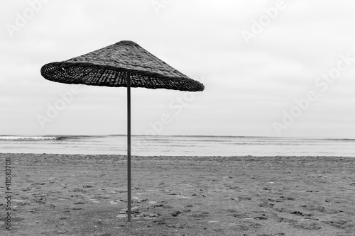 Umbrellas on empty beach  Black and White