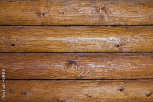 Wooden log wall texture background. The wall of old wooden house.