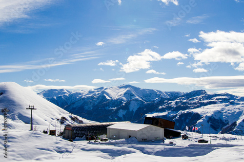 Ski resort, snowy mountains and hostels.