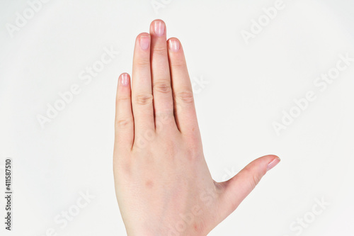 Female hand close-up isolated on white background. © Andrei Sitnikov