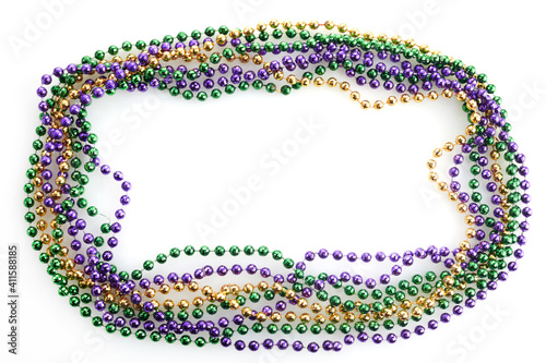 A frame of three colors of Mardi gras beads on white background