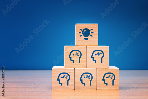Wooden cube block with head human symbol and light bulb icon. Teamwork it's an easy way to resolve problem. Concept creative idea.