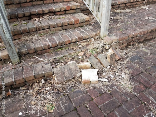 damaged or broken red brick masonry steps or stairs