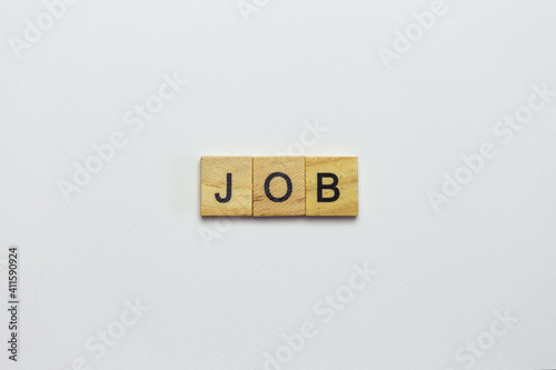 The inscription job made from wooden small cubes on a white background. Search robots, advertising, banner.