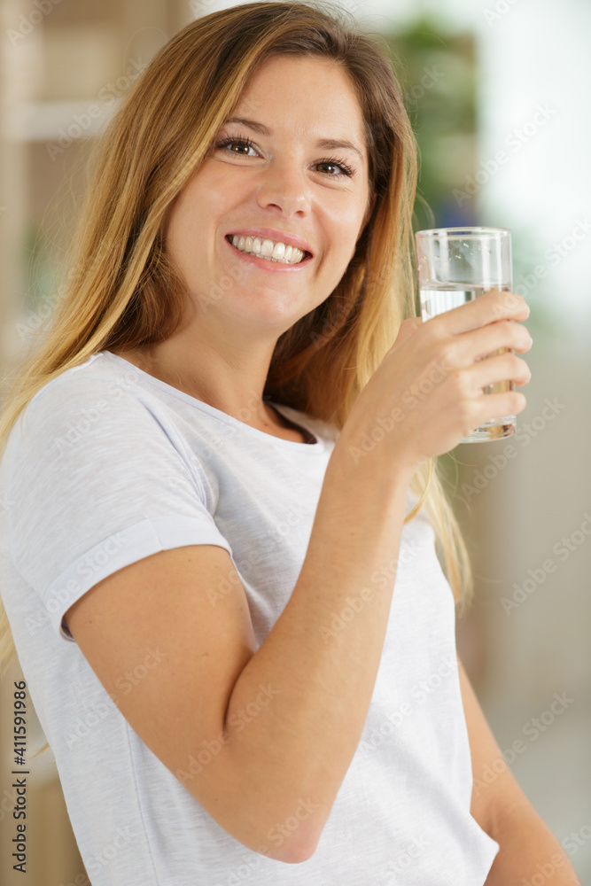 beautiful young woman drinking a fresh glass of water beautiful young woman drinking a fresh glass of water