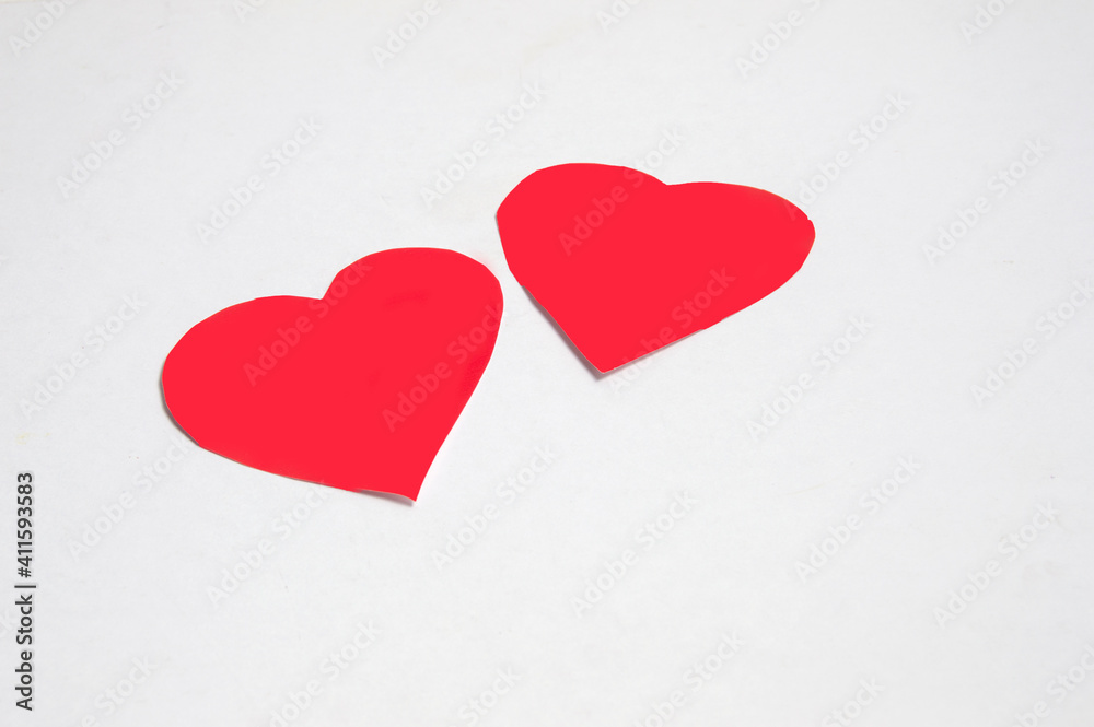 two red paper hearts isolated on white background