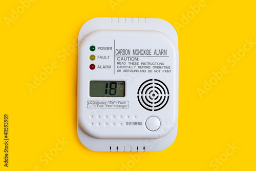 Carbon monoxide detector on a yellow background CO detector