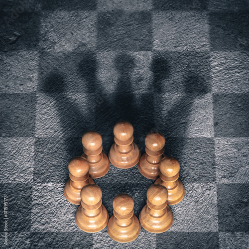 Group Of Pawns On Chessboard Creating Shadow Of Kings Crown - Business Teamwork Fototapet