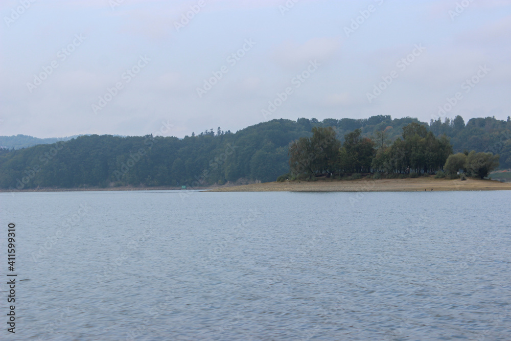 Looking at the surface of a large and beautiful mountain lake Looking at the surface of a large and beautiful mountain lake