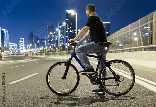 Men on Bicycle On A Empty Road,  Tel Aviv, Israel © Dmitry Pistrov