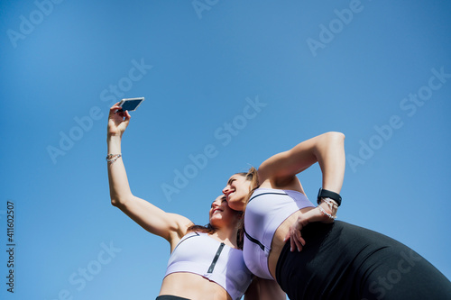 two women taking a selfie after training
