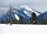 Snowy winter landscape with snow covered mountains and 46er High Peaks popular for hiking and climbing, Adirondacks New York