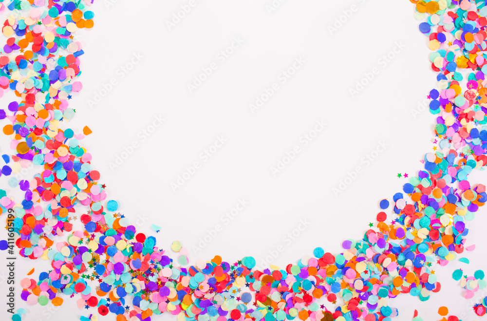 colorful confetti on a white background. Top view.