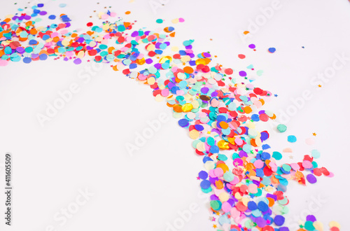 colorful confetti on a white background. Top view.
