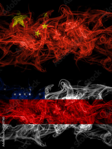 China, Chinese vs Brazil, Brazilian, Amazonas smoky mystic flags placed side by side. Thick colored silky abstract smoke flags.